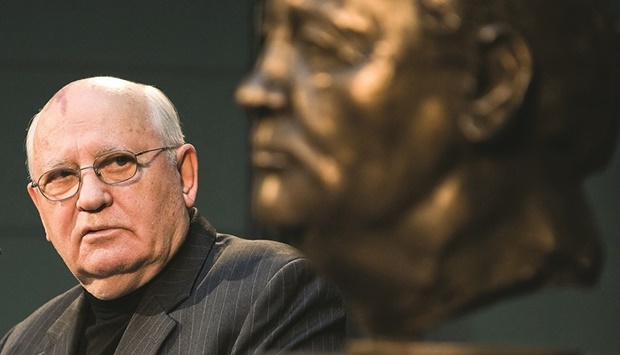 In this file photo taken on November 9, 2009 the last Soviet president Mikhail Gorbachev looks at a bust of himself by French artist Serge Mangin after unveiling it to guests in Berlin as Germany was celebrating the 20th anniversary of the fall of the Berlin Wall with many world leaders coming to Berlin to mark the event. (AFP)