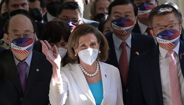 Visiting US House Speaker Nancy Pelosi (C) waves to journalists during her arrival at the Parliament in Taipei on August 3, 2022.  Photo: Sam Yeh / AFP)