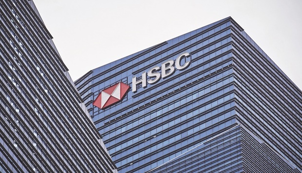 Signage for HSBC Holdings headquarters is displayed on the building that houses its headquarters in the central business district of Singapore. HSBC kickstarted its public fightback against Ping An Insurance Group Cou2019s push to break it up this week. The early indications are that the lender has a long way to go to convince some shareholders of its strategy.