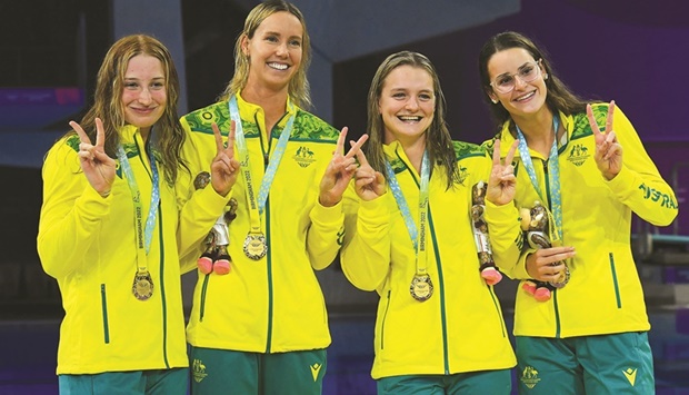 Australian medallists Mollie Ou2019Callaghan, Emma  McKeon, Chelsea Hodges and Kaylee McKeown pose during the medal ceremony for the womenu2019s 4x100m medley relay swimming final in Birmingham. (AFP)