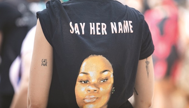 This file photo taken in 2020 shows a picture of Breonna Taylor on a T-shirt during a u2018Stand 4 Breonnau2019 in Austin, Texas.