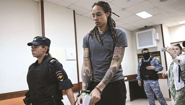 Griner is escorted out after the courtu2019s verdict in Khimki outside Moscow.
