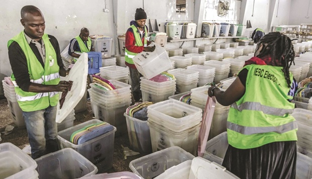 IEBC Election Officials clean ballot boxes and electoral material of the Independent Electoral and Boundaries Commission (IEBC) at a tallying centre in Nairobi, Kenya, yesterday, ahead of Kenyau2019s general election.