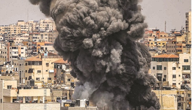 Smoke billows from an Israeli air strike in Gaza City.