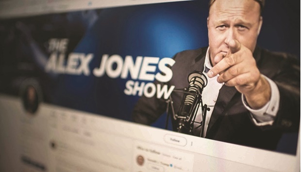 This file photo taken in 2018 shows a computer screen displaying the Twitter account of Alex Jones.