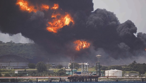 Fire is seen over fuel storage tanks that exploded near Cubau2019s supertanker port in Matanzas.