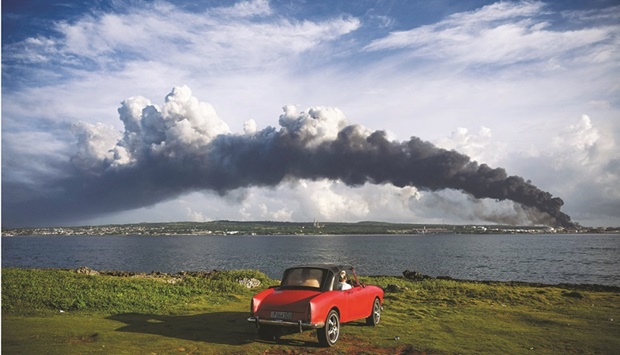 Black smoke from oil tanks on fire is seen near Matanzas Bay, Cuba, yesterday.