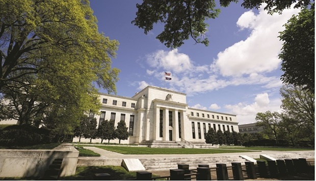 The Federal Reserve building is set against a blue sky in Washington. Fed policy makers in June saw joblessness rising to 4.1% in 2024 u2013 just above the level they consider maximum employment u2013 as inflation decelerated to close to their 2% target.