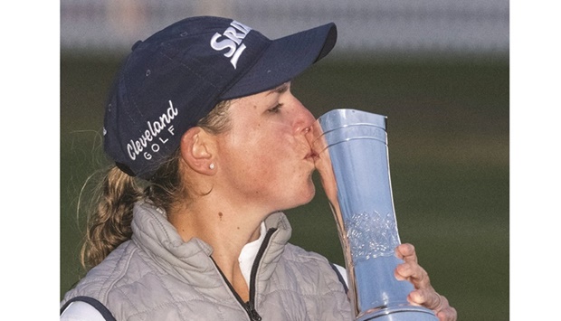 South Africau2019s Ashleigh Buhai kisses the trophy after her playoff win over South Koreau2019s Chun In-gee on day 4 of the 2022 Womenu2019s British Open.