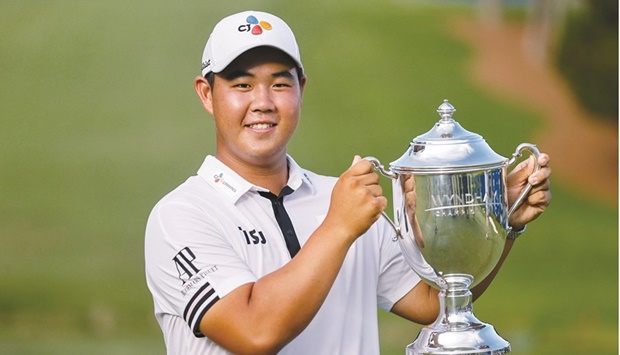 Joohyung Kim holds his trophy after winning the Wyndham Championship golf tournament. (USA TODAY Sports)