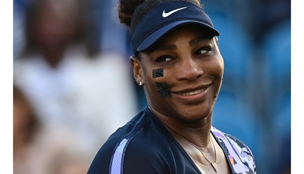 In this file photo taken on June 21, 2022, US player Serena Williams reacts as she plays with Tunisia's Ons Jabeur against Spain's Sara Sorribes Tormo and Czech Republic's Marie Bouzkova during their round of 8 women's doubles tennis match , on day three, of the Eastbourne International tennis tournament in Eastbourne, southern England. AFP