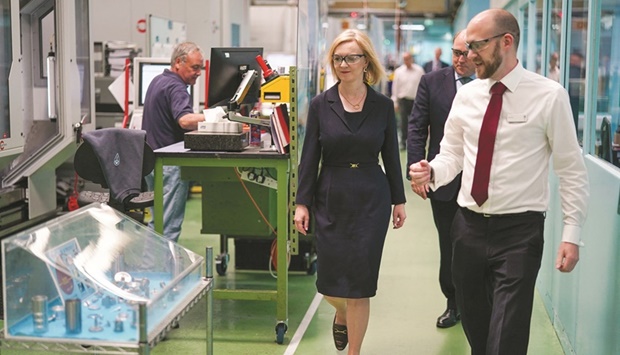 Britainu2019s Conservative Party leadership candidate Liz Truss visits the Reliance Precision engineering company ahead of a hustings event later, in Huddersfield, Britain, yesterday.