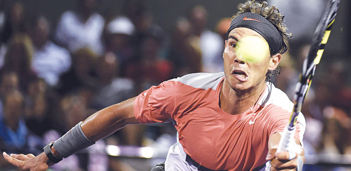 Rafael Nadal of Spain returns the ball to Lleyton Hewitt of Australia during their match. (EPA)