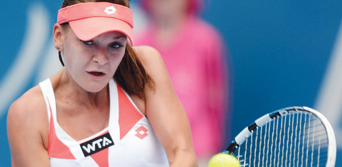   Top seed Agnieszka Radwanska of Poland plays Kimiko Date-Krumm of Japan on the third day of the Sydney International Tennis tournament in Sydney, Au
