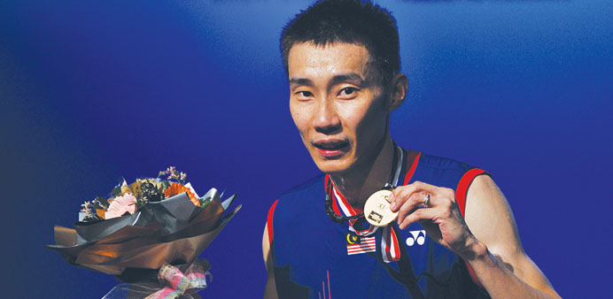 Lee Chong Wei of Malaysia poses with the trophy after winning the menu2019s single final of the BWF badminton World Superseries in Kuala Lumpur yesterday.