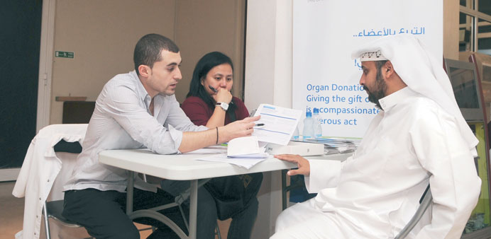 HMC staff are seen explaining the benefits of organ donation to a visitor at one of the awareness sites.