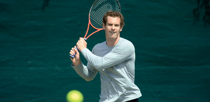 Britainu2019s Andy Murray attends a training session at the practice courts at the All England Club in London yesterday. (AFP)