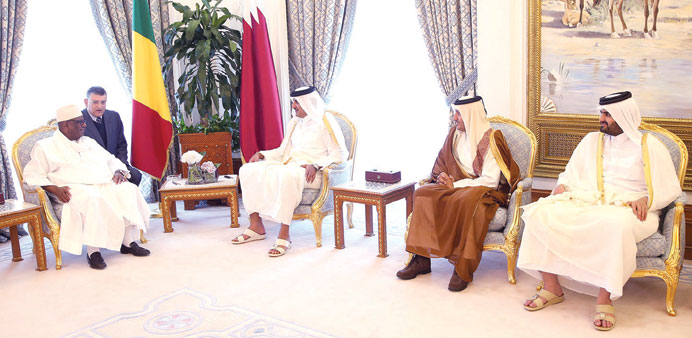 HH the Emir Sheikh Tamim bin Hamad al-Thani holding talks with President Ibrahim Boubacar Keita of Mali at the Emiri Diwan yesterday.