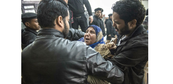Relatives and supporters of Egyptian activist Alaa Abdel Fattah react after the verdict in his trial at a police institute in Cairou2019s Tora prison.