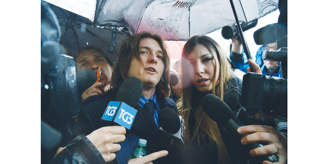 Raffaele Sollecito (centre) arrives at the Supreme Court in Rome for a review of his trial.