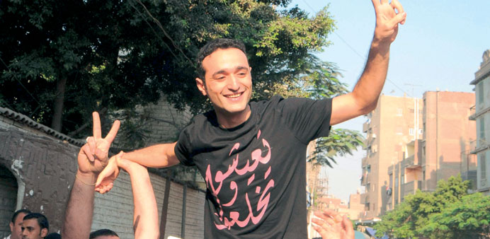 Douma flashes a victory sign upon his release yesterday.