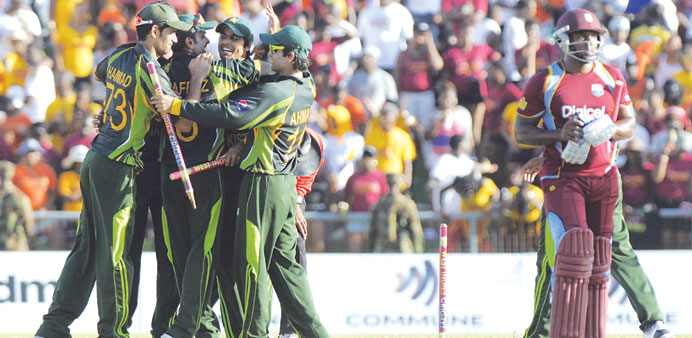 Pakistani players celebrate their victory in the second Twenty20 International against West Indies in St Vincent on Sunday. (WICB)