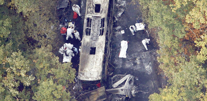 An aerial view of French investigators in protective suits working at the accident site near Puisseguin.
