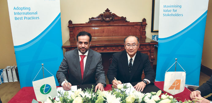 Al-Kuwari and Masuda signing the contract in London.