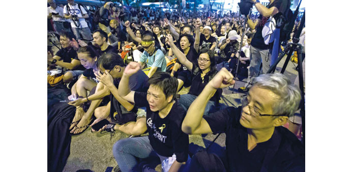 Occupy Central protesters shout slogans during a rally after a march in Hong Kong yesterday.