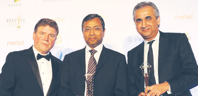 Michael Gallagher, president and founder of the Stevie Awards, Sunil John and Bashar al-Kadhi, COO of ASDAu2019A Burson-Marsteller, at the awards ceremony