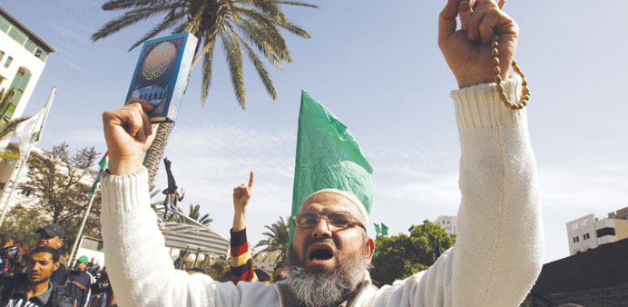Hamas supporters chant slogans during a march following Friday prayers in Gaza City.