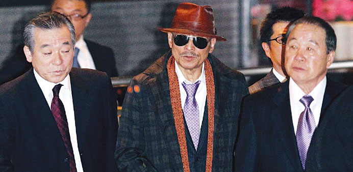 Kenichi Shinoda, the boss of Japanu2019s largest yakuza gang, at Tokyou2019s Shinagawa station in 2011 as he returns to his home in Kobe after he was released
