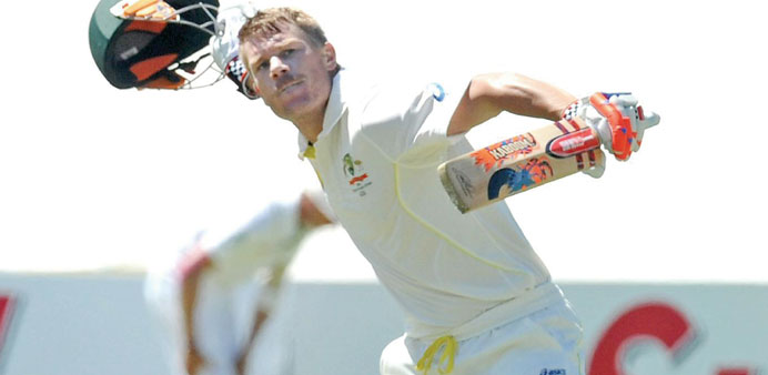 David Warner of Australia celebrates his century on the first day of the third Test cricket against South Africa and Australia at Newlands in Cape Tow