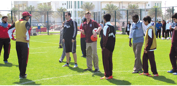 Sport experts brief young Qatari participants during the training. 