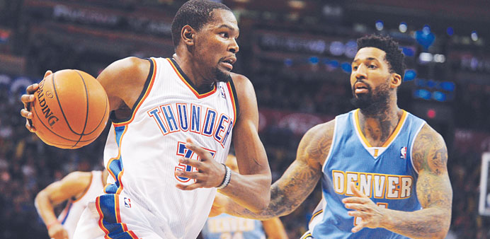 Oklahoma City Thunder small forward Kevin Durant handles the ball against Denver Nuggets small forward Wilson Chandler during the third quarter at Che