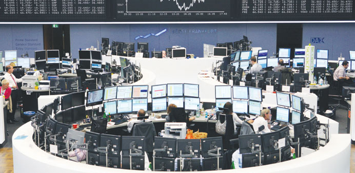 Traders monitor data on computer screens at the Frankfurt Stock Exchange (file). Investors, worried by the threat of deflation, are turning more cauti