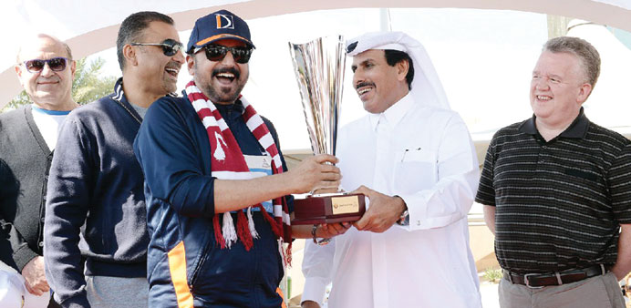 Sheikh Abdulla bin Saud al-Thani presenting the trophy to Dr Seetharaman.