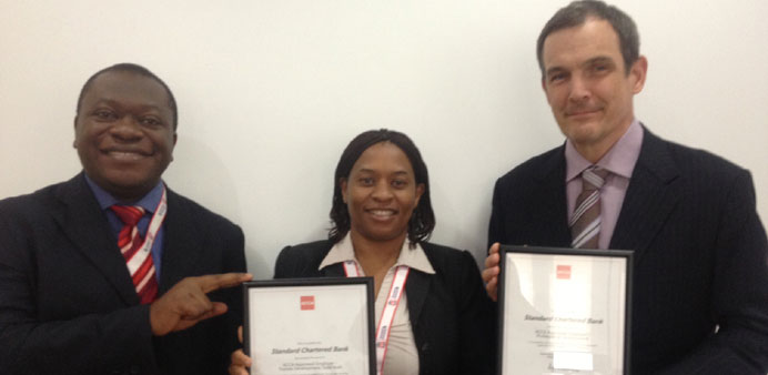 Makia Efimba, Sinodia Gwavava and Jay Maruszewski, the three ACCA-certified professionals in Qatar.