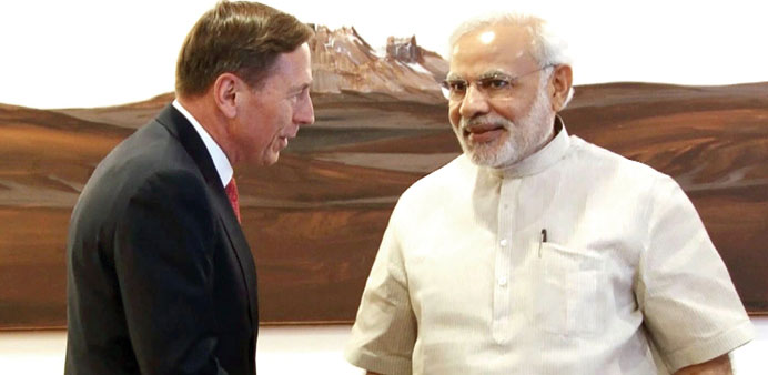 Head of KKR Global Institute and former US Army General David Petraeus shakes hands with Prime Minister Narendra Modi ahead of a meeting in New Delhi 