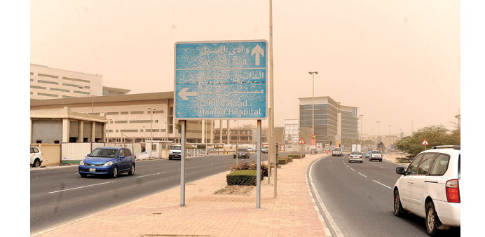  THE NEXT DAY: A road sign covered in sand on April 2. Hours after the sandstorm subsided, there was still enough sand in the air to affect visibility