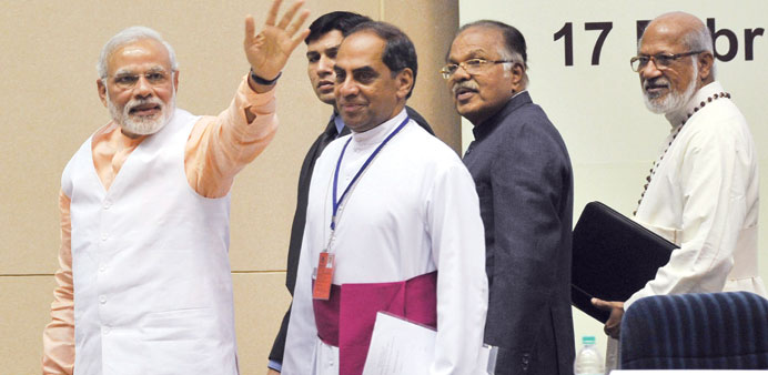 Prime Minister Narendra Modi waves as he arrives to address a conference organised by Christian organisations at Vigyan Bhawan in New Delhi yesterday.