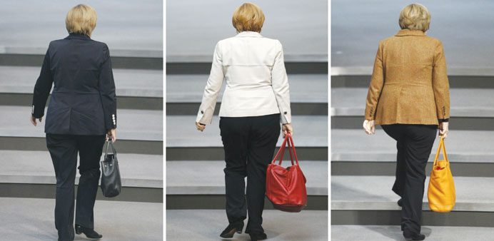 Combination file photos of German Chancellor Angela Merkel, carrying handbags that make up the colours of the German national flag.