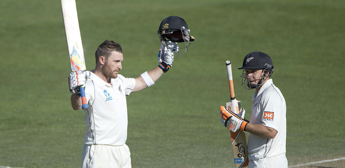 New Zealand captain Brendon McCullum (left) celebrates after reaching to his hundred even as team-mate BJ Watling looks on, during day three of the se