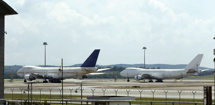 Two of three abandoned Boeing 747-200F planes are seen parked on the tarmac at Kuala Lumpur International Airport in Sepang,