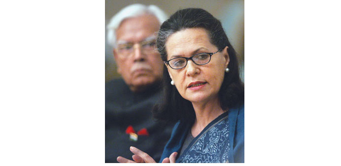 In this photograph of June 11, 2005, Sonia Gandhi is watched by then foreign minister Natwar Singh as she delivers a speech in Moscow.