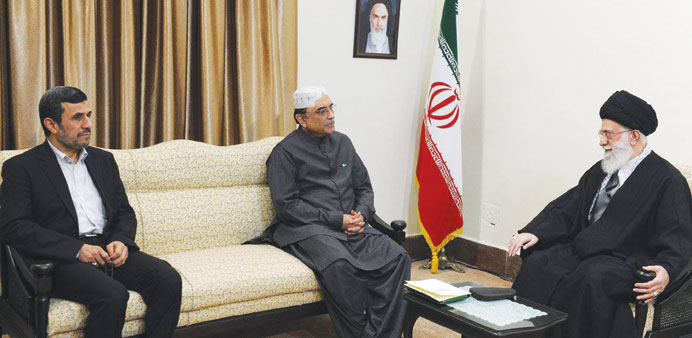 Iranian Supreme Leader Ayatollah Ali Khamenei talking with Pakistanu2019s President Asif Ali Zardari and Iranu2019s President Mahmoud Ahmadinejad during a mee