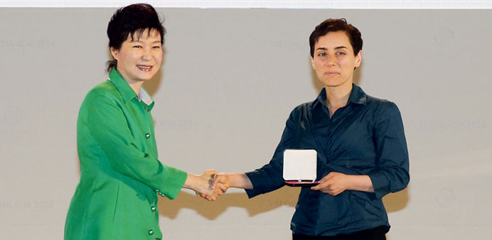 South Korean President Park Geun-Hye gives the prize to Maryam Mirzakhani at the awards ceremony in Seoul yesterday. 