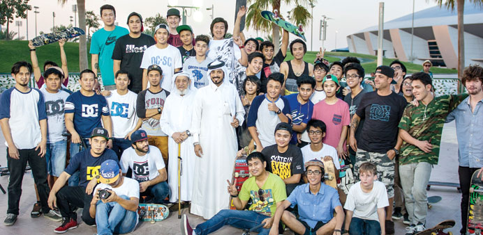 Salem al-Sayed and his son Farhan with participants of the second BMX and skateboarding championship at Aspire Zone