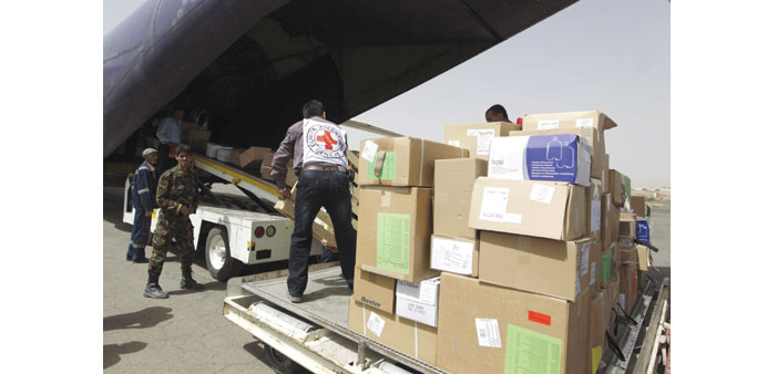 Emergency medical aid from the International Committee of the Red Cross is unloaded from a plane at the Sanaa international airport yesterday. 