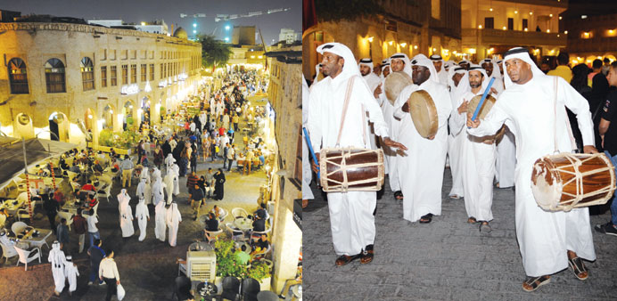 A view of the crowded Souq Waqif alley during the conclusion of the festivities yesterday.A traditional music troupe parades through the Souq Waqif al